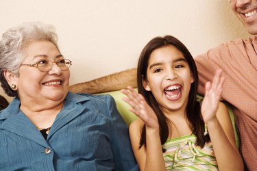 Girl (10-11) with grandmother, smiling