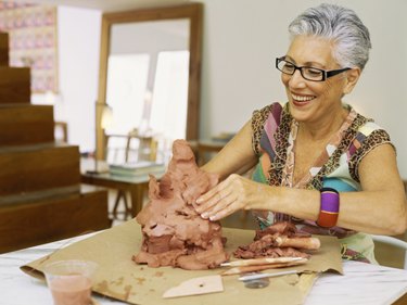 Close up of a senior woman sculpting