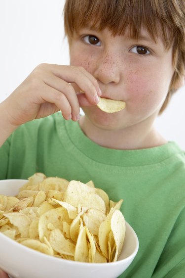 Boy eating potato chips
