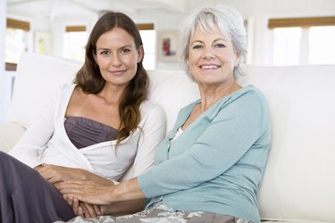 Mother and daughter holding hands