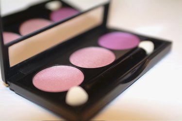 Close-up of an eyeshadow palette and brush