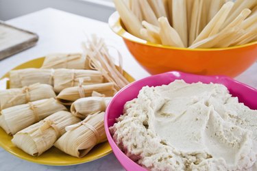 Tamales, corn husks, and masa