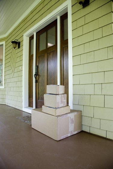 Stack of moving and/or mailing boxes by front door