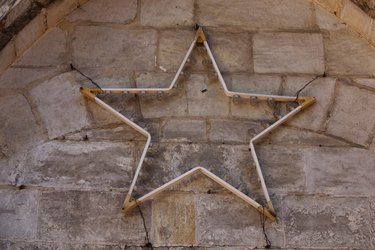 Star light hanging on stone wall