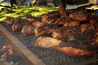 Barbegue Beef and corn over a wood burning BBQ.