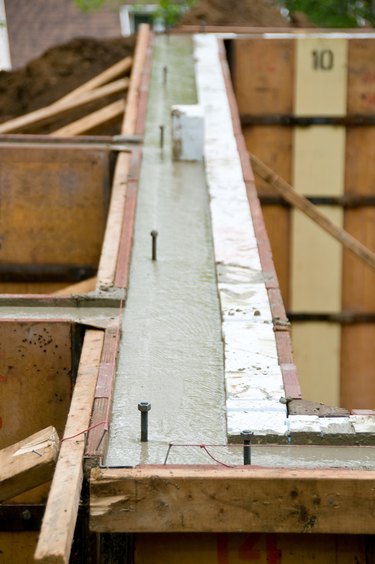 Concrete setting inside wall molds at construction site