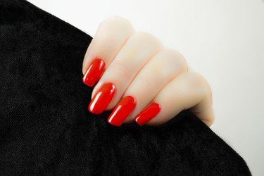 woman's hand with red nails
