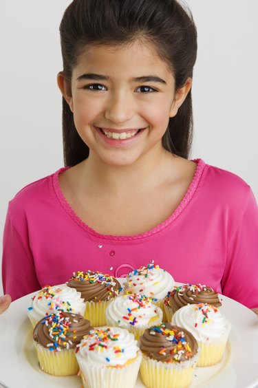 Girl with cupcakes