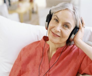 close-up of a senior woman wearing headphones