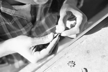 Person making jewelry