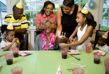 Family giving surprise party to grandmother