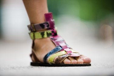 Close-up of stylish sandal on woman's foot