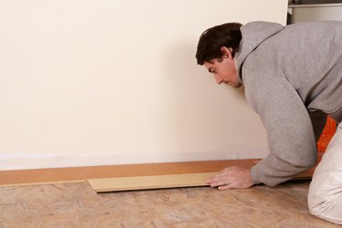 Man installing flooring