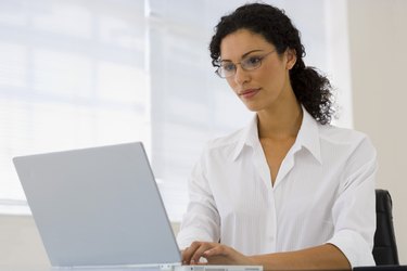 Businesswoman using laptop computer