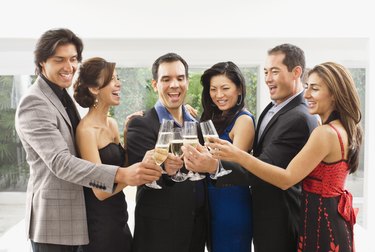 Multi-ethnic couples toasting with champagne