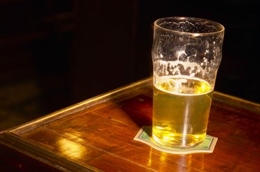 Glass of beer on wooden table