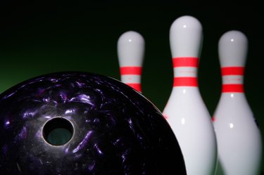 Bowling ball and bowling pins (focus on ball in foreground)