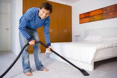 Man vacuuming floor