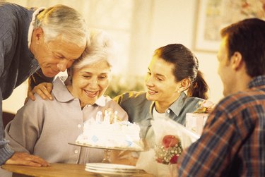 Senior woman celebrating her birthday with family