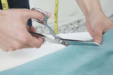 Person cutting fabric