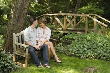 Couple sitting on park bench