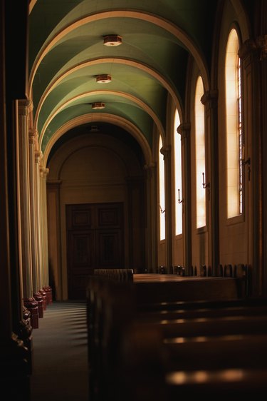 Rear view of a woman standing inside a church