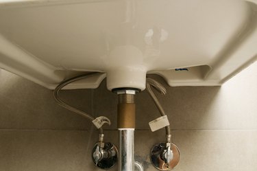 Plumbing underneath bathroom sink