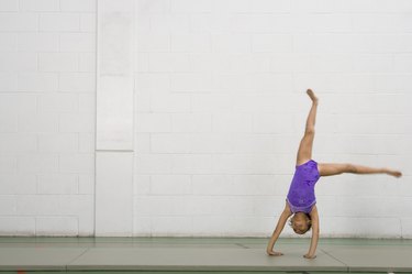 Gymnast girl doing cartwheel
