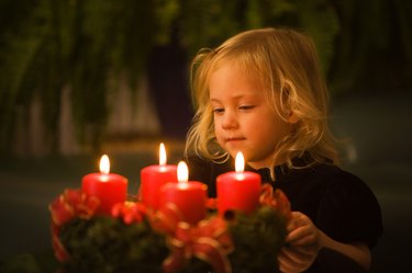 Child with Advent wreath at Christmas