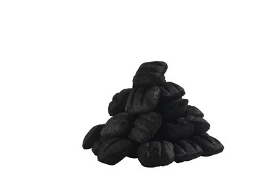 Heap of coal on white background