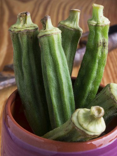 Group of green okra in a ceramic pot