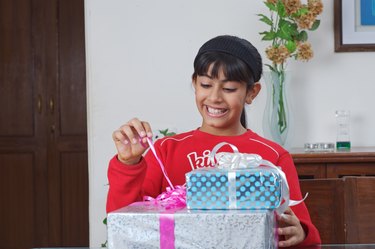 Girl opening a gift pack