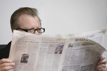 man reading newspaper