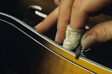 Hand carving wooden guitar, close-up