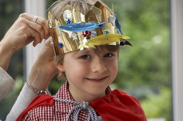 boy dressing up as king