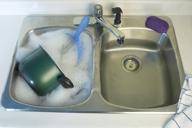 Dishes in sink with suds