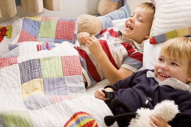 Boys lying in bed