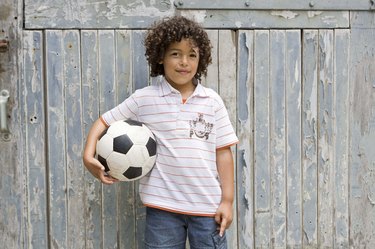 Portrait of boy with soccer ball