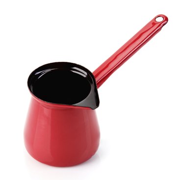 Red pot with long handle for making turkish coffee
