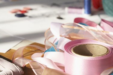 Rolls of ribbon on table, close-up