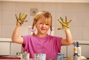 Girl with paint on hands