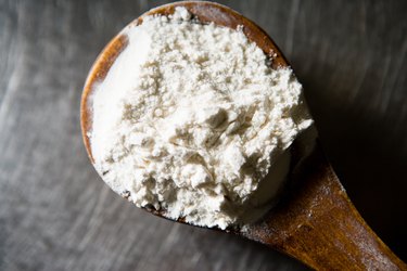 Flour on wooden spoon