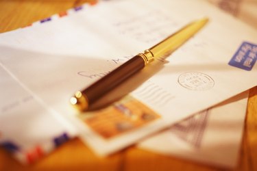 Letter opener resting on air mail envelope