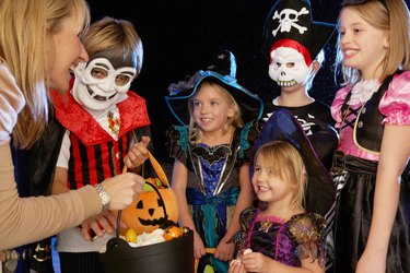 Happy Halloween party with children trick or treating