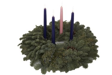 Advent wreath with burning candles, elevated view