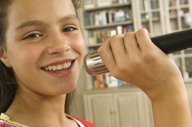 Girl singing into microphone