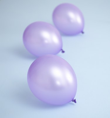Three purple balloons.