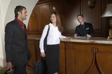 Couple checking into hotel