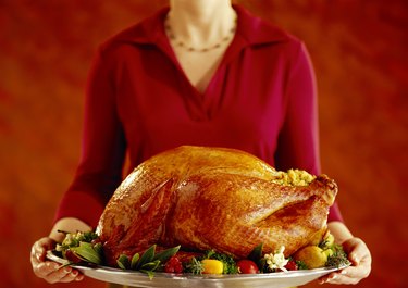 Woman with roast turkey