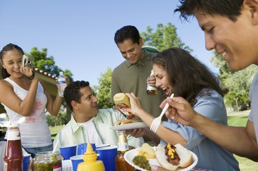 Family Gathered Around Picnic Table